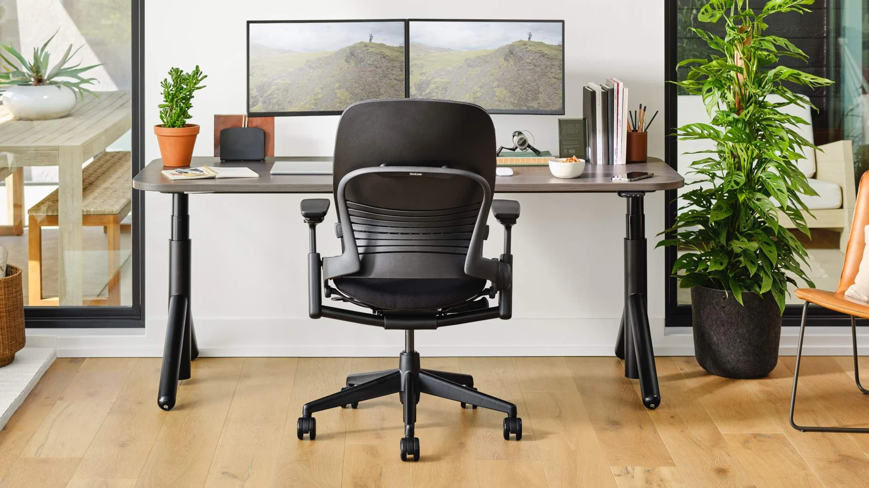 Steelcase-Flex-Height-Adjustable-Desk-With-Leap-At-Desk-Family-Image.webp